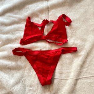 Bright red two piece swimsuit set.